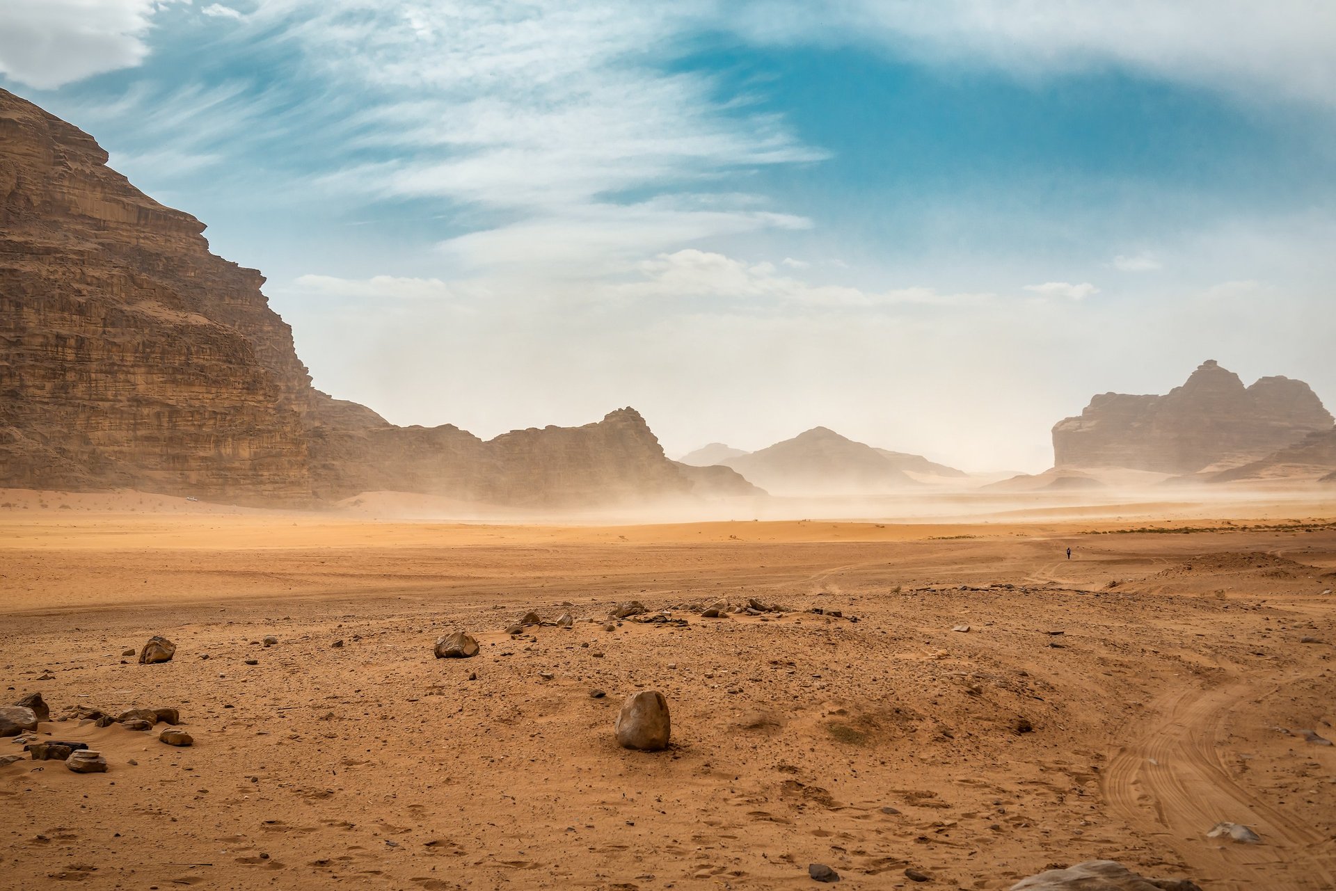 The wind raises the dust in Wadi Rum, Sahara or Arabian desert